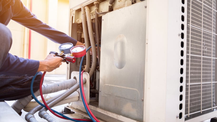 ac-technician https://happyhvacsolutions.com/wp-content/uploads/2024/09/ac-technician.jpeg